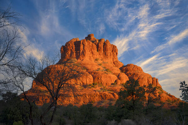 Sedona lanscape scene of a closeup of Bell Rock with exploding clouds in the sky