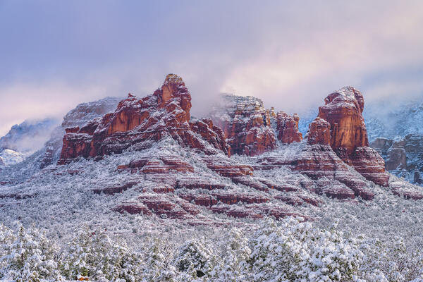 Sedona lanscape scene of red rock formations covered in fresh snow
