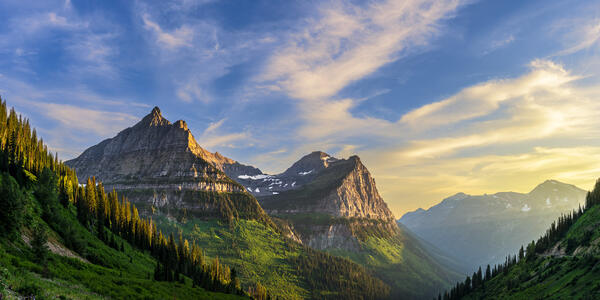 panoramic view of the sunset over the mountains at glacier national park