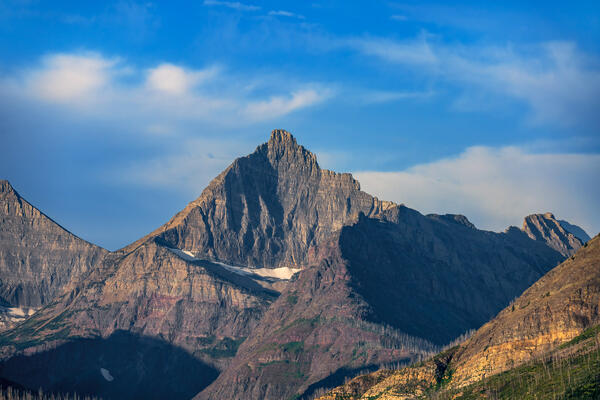 a closeup of a very pointed and distinctive mountain in glacier national park
