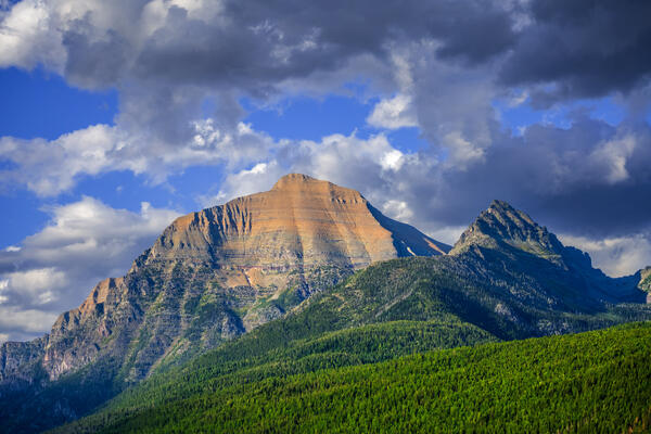 view of mountains at bowman lake in glacier national park