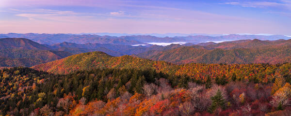 view of layers of mountains in fall colors along the Blue Ridge Parkway