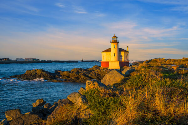 Oregon Coast landscape scene of an early morning view of the Coquille River Lighthouse in Bandon