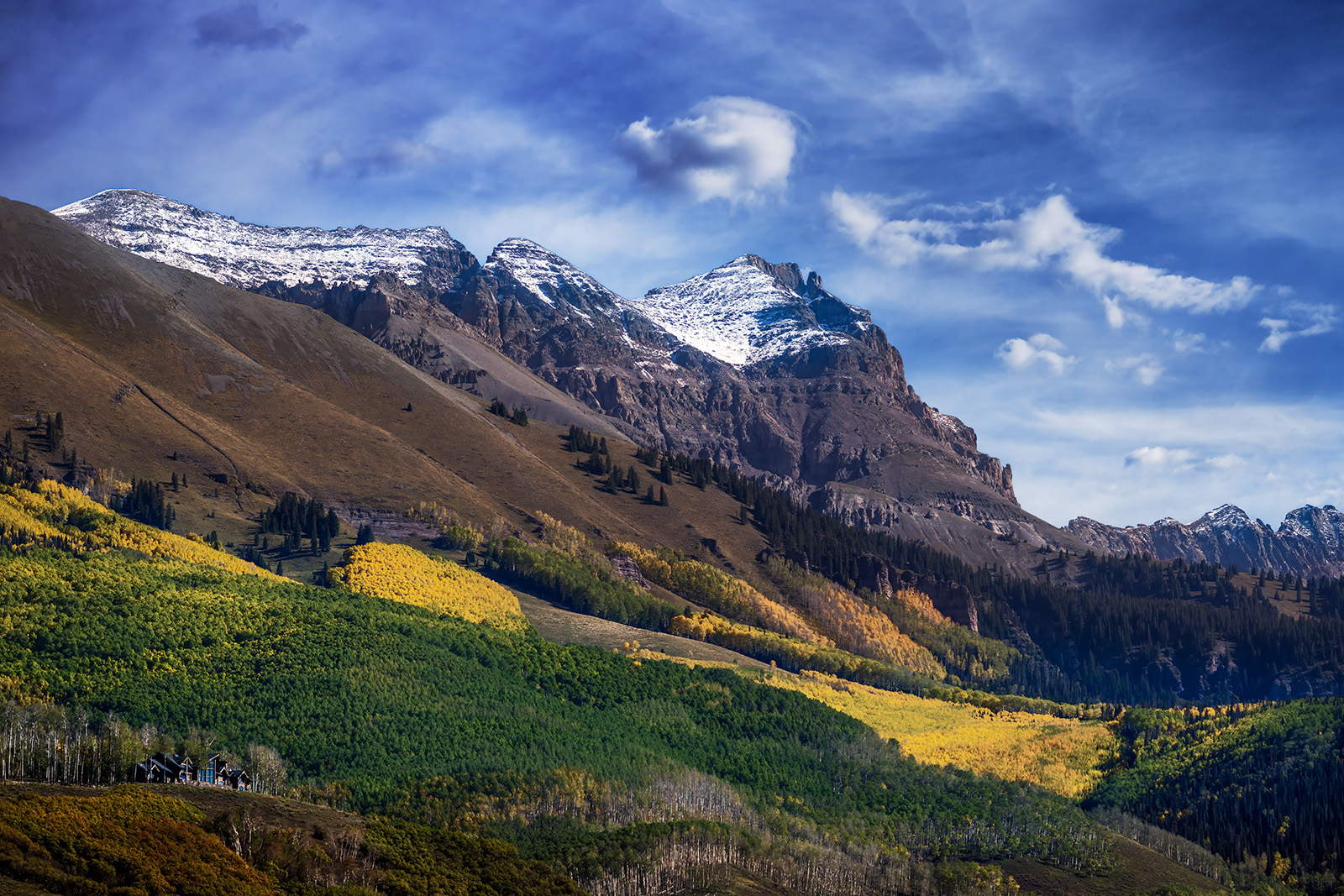 First Snow Snow on mountain peaks above fall color in Telluride, Colorado