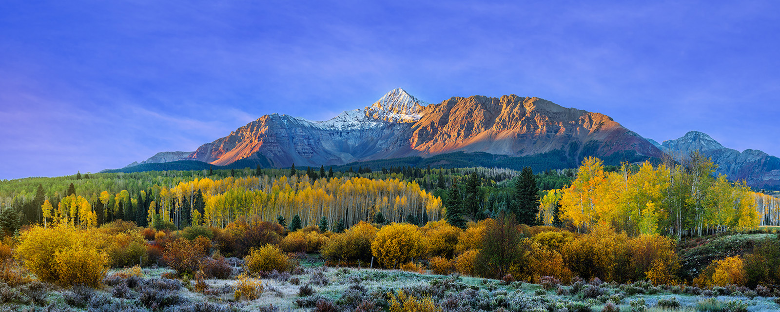 Wilson's Majesty panoramic landscape view of a beautiful snow-capped mountain with fall color at its peak