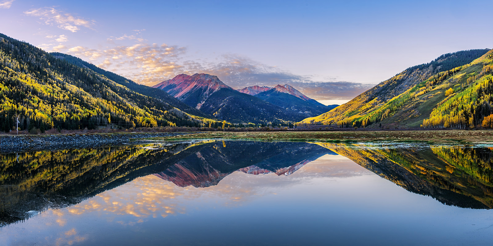 Crystal Fall Reflection Colorado mountains with fall colors reflecting perfectly in a lake at sunrise