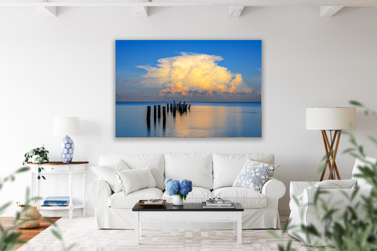 Florida beach photography print of old pier on the wall above a sofa