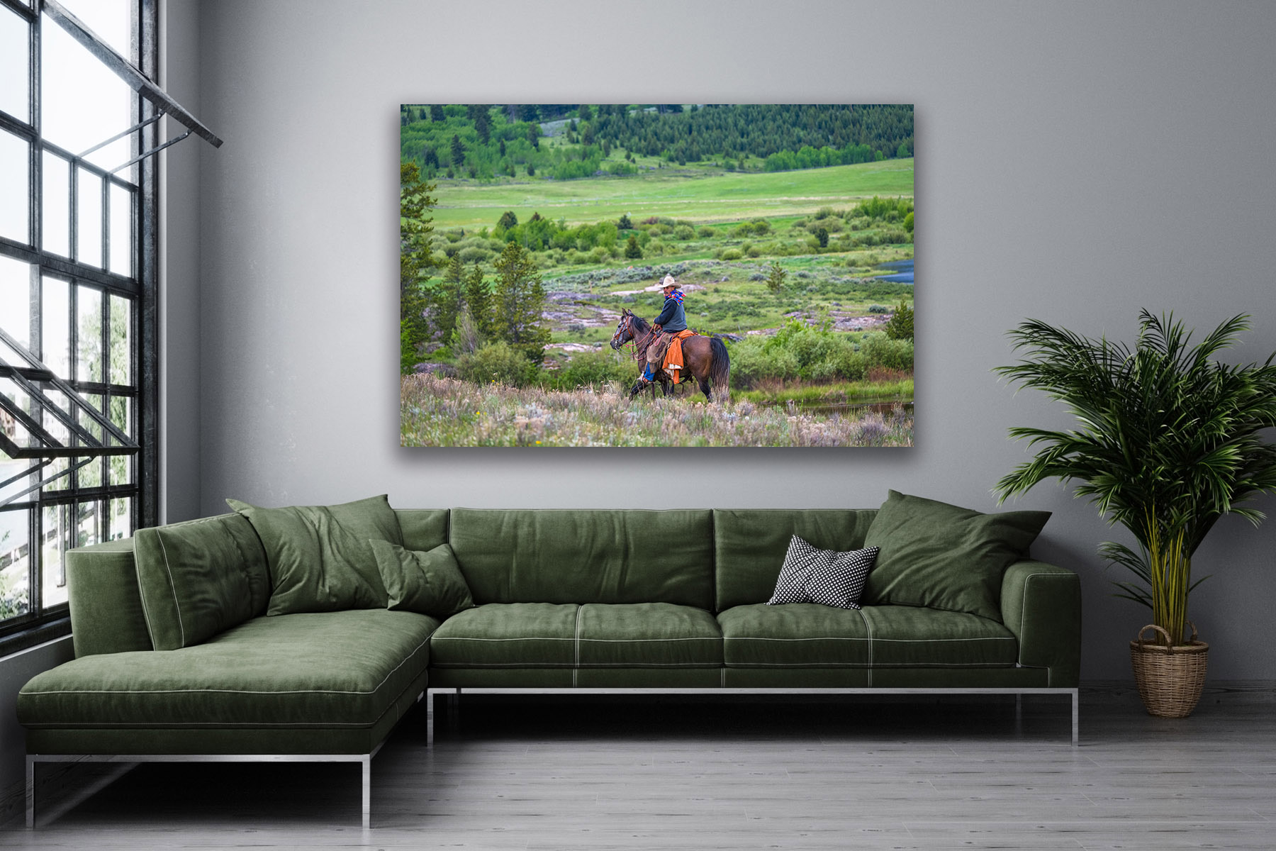 Cowboy on a horse checking on the herd as a fine art photo print on the wall