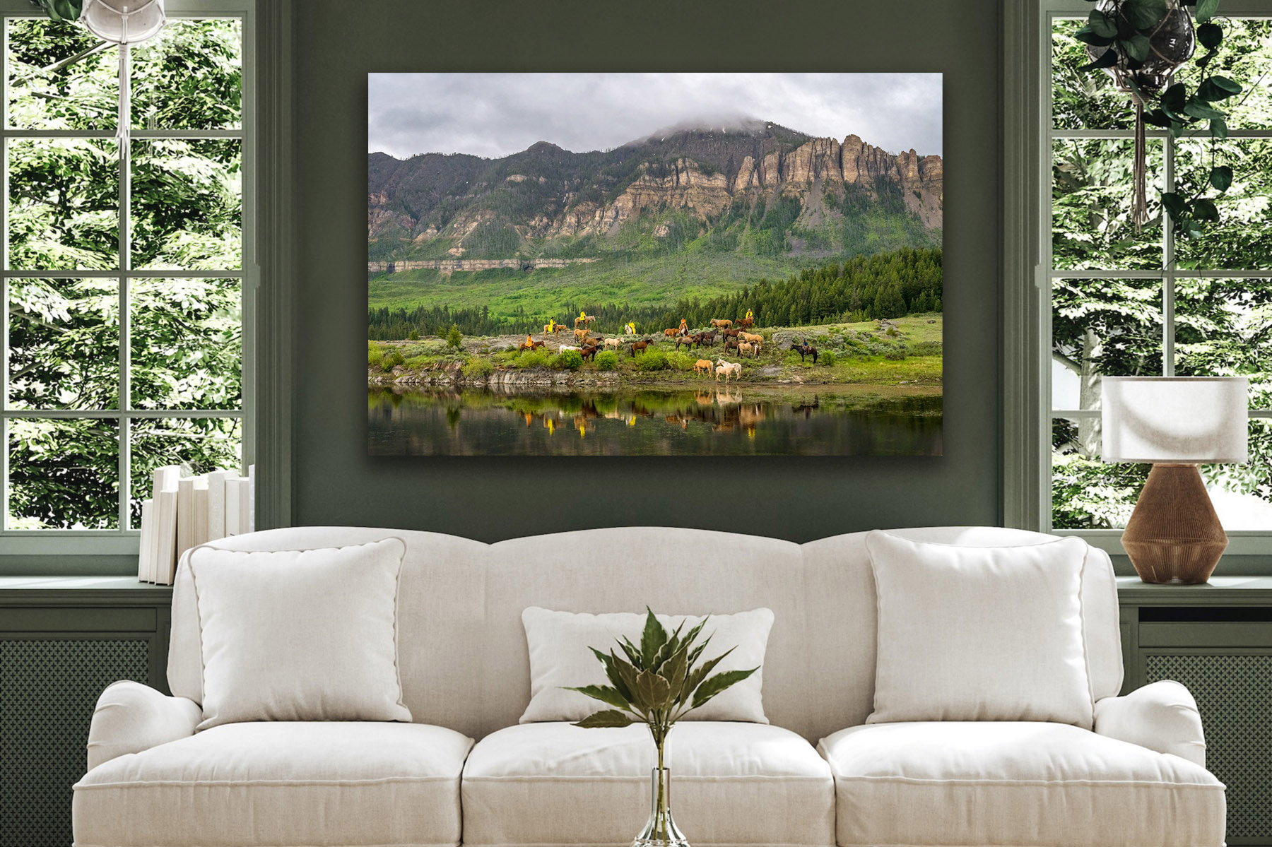 Cowboys gathering horses during a rainy day as a fine art print on the wall
