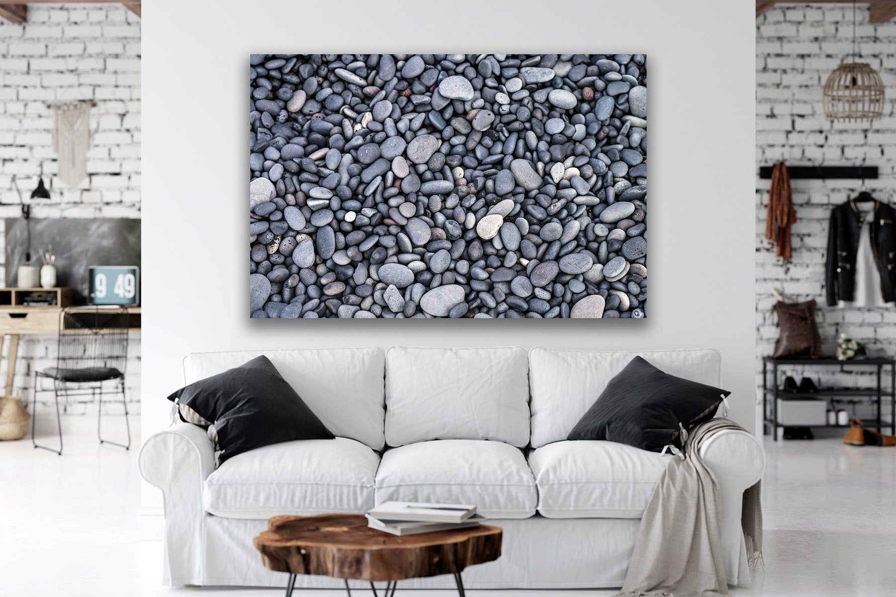 a closeup of the gray stones on the black beach in Iceland as a print on the wall