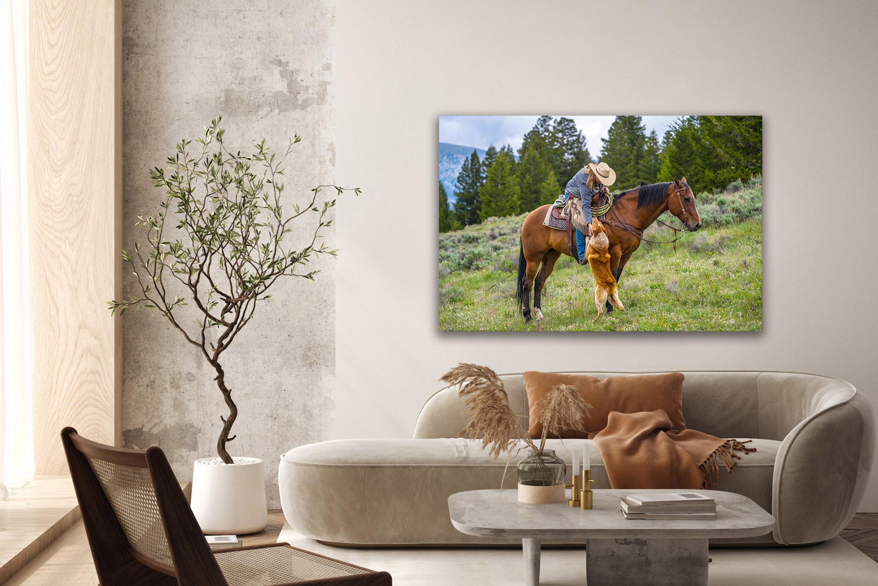 Cowgirl on a horse reaching down to her dog as a fine art photo print on the wall