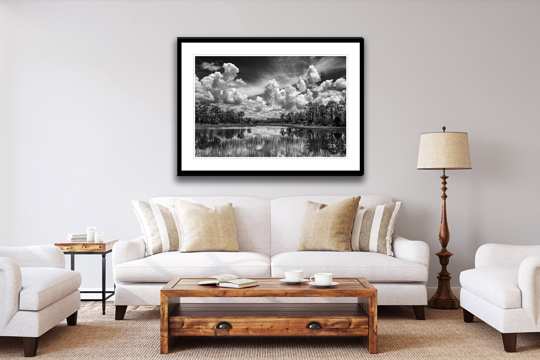 black and white view of big white clouds over webb lake as a print on a wall